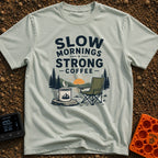 Slow Start Strong Brew - T-Shirt in Bay - The artwork features the text "SLOW MORNINGS STRONG COFFEE" above an...