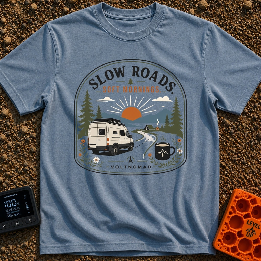 Sip Slow Roll Easy - T-Shirt in Blue Jean - A graphic illustration of a white camper van driving on a winding road toward...
