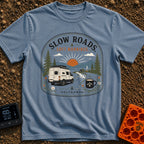 Sip Slow Roll Easy - T-Shirt in Blue Jean - A graphic illustration of a white camper van driving on a winding road toward...