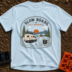 Sip Slow Roll Easy - T-Shirt in Chambray - A graphic illustration of a white camper van driving on a winding road toward...