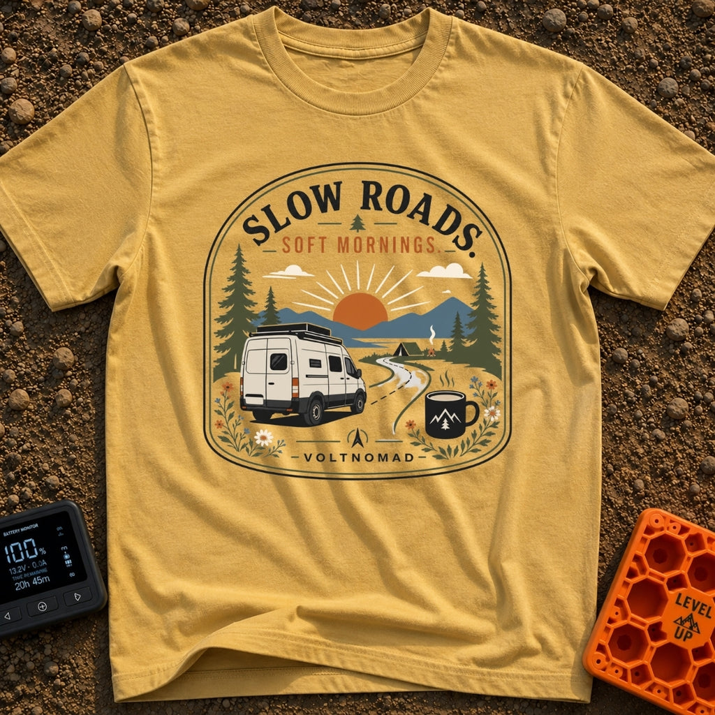 Sip Slow Roll Easy - T-Shirt in Mustard - A graphic illustration of a white camper van driving on a winding road toward a...