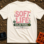 Powered By Soft Life - T-Shirt in Ivory - A typographic design featuring large pink bubbly text reading "SOFT LIFE" above...