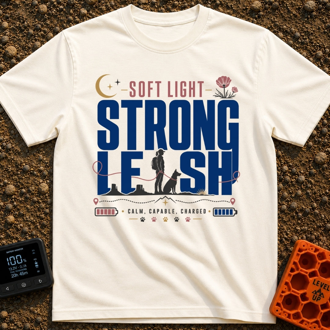 Soft Light Lead - T-Shirt in Ivory - A typographic design featuring the words 'SOFT LIGHT STRONG LEASH' integrated with a...