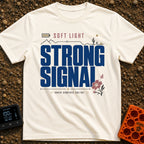 Soft Light Strong Signal - T-Shirt in Ivory - A typographic design with the text 'SOFT LIGHT' and 'STRONG SIGNAL',...