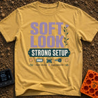Soft Look Hard Wired - T-Shirt in Mustard - The design features the text "SOFT LOOK" in large purple letters beside a...
