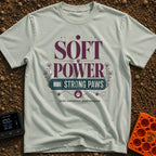 Soft Power Strong Paws - T-Shirt in Bay - A typographic design with the words "SOFT POWER" above a banner reading "STRONG...