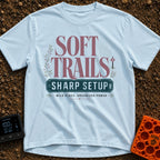 Wired For The Wild - T-Shirt in Chambray - A typographic design featuring the words "SOFT TRAILS" in large serif letters...