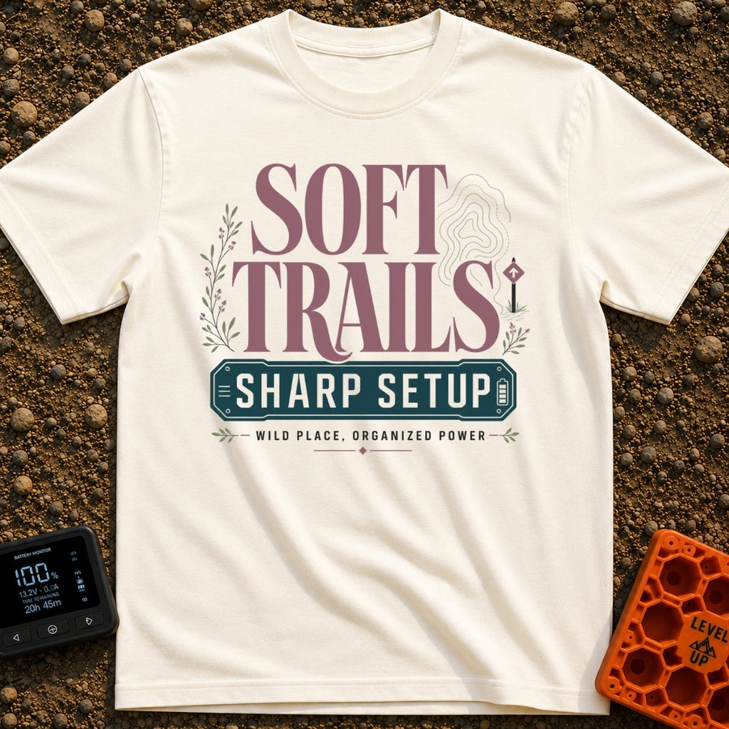 Wired For The Wild - T-Shirt in Ivory - A typographic design featuring the words "SOFT TRAILS" in large serif letters...