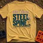 Speak Softly Charge Hard - T-Shirt in Mustard - The design features the text "SOFT VOICE, STEEL SPINE" and "CALM,...