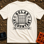 Watt Is My Balance - T-Shirt in Ivory - A distressed black-and-white circular emblem featuring an abacus whose beads are...