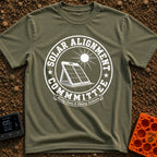 Solar Alignment Crew - T-Shirt in Moss - A distressed circular graphic featuring a portable folding solar panel propped...