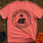Solar Alignment Crew - T-Shirt in Watermelon - A distressed circular badge design featuring a portable, folding solar...