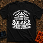 Solar Powered Overthinking - T-Shirt in Black - A distressed, black-and-white typographic design reading 'POWERED...