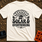 Solar Powered Overthinking - T-Shirt in Ivory - A distressed, black-and-white typographic design reading 'POWERED...