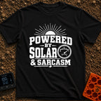 Solar Powered Snark - T-Shirt in Black - A distressed typography design reading "POWERED BY SOLAR & SARCASM" featuring a...