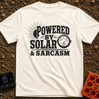 Solar Powered Snark - T-Shirt in Ivory - A distressed typography design reading "POWERED BY SOLAR & SARCASM" featuring a...