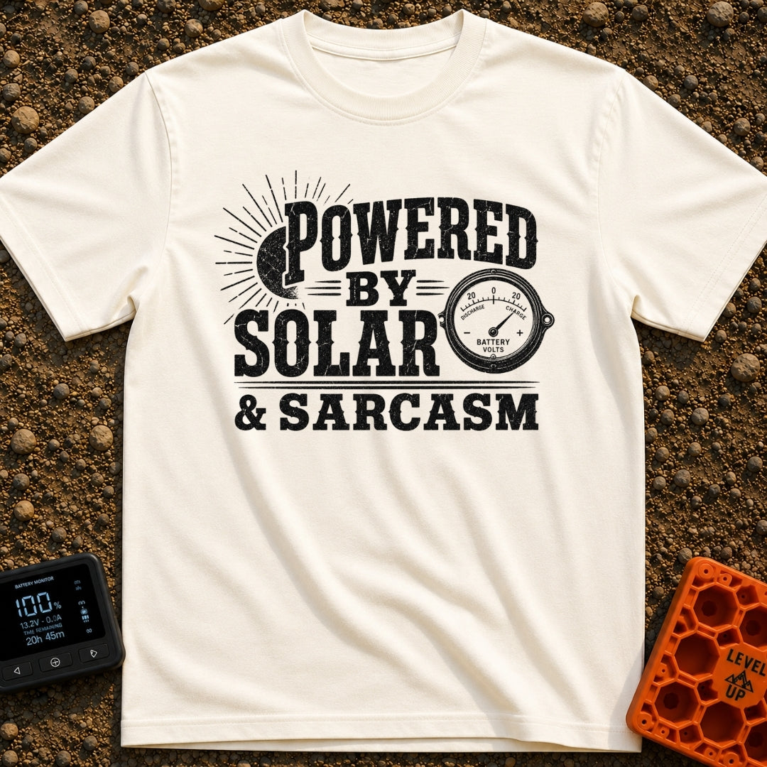 Solar Powered Snark - T-Shirt in Ivory - A distressed typography design reading "POWERED BY SOLAR & SARCASM" featuring a...