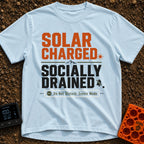 Solar Charged Socially Drained - T-Shirt in Chambray - Text-based design featuring the words "SOLAR CHARGED" in orange...