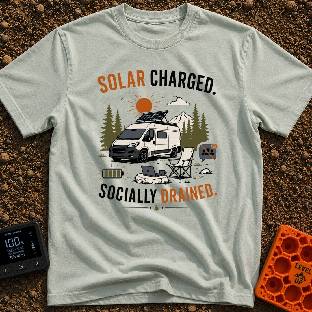 Solar Charged Socially Done - T-Shirt in Bay - A white camper van with a tilted roof solar panel is parked near pine...