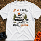 Solar Charged Socially Done - T-Shirt in White - A white camper van with a tilted roof solar panel is parked near pine...