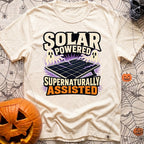 Supernaturally Solar Powered - T-Shirt in Ivory - An illustration of a solar panel on a stand being zapped with purple...