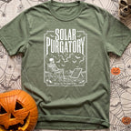 Waiting On A Watt - T-Shirt in Moss - A black and white illustration of a skeleton sitting in a folding camp chair in a...