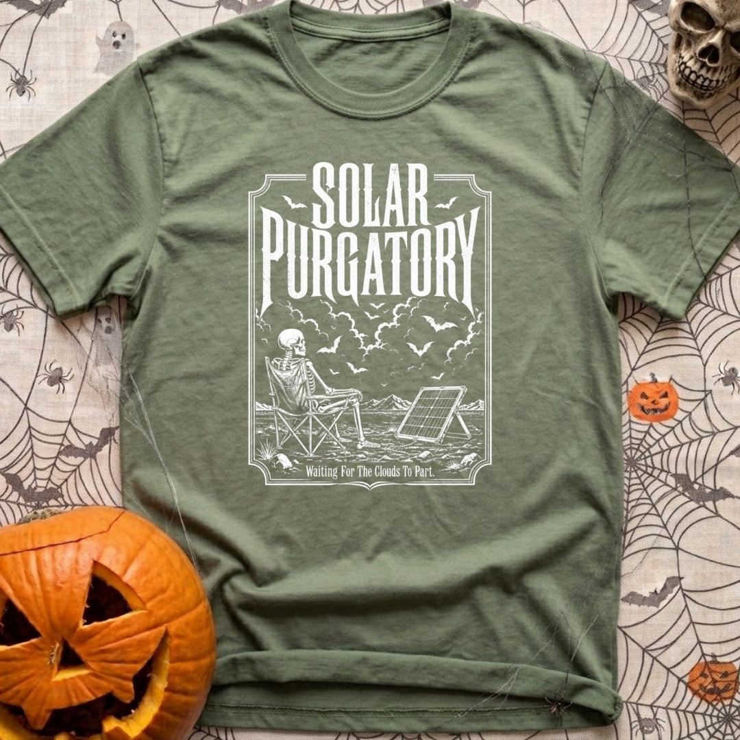 Waiting On A Watt - T-Shirt in Moss - A black and white illustration of a skeleton sitting in a folding camp chair in a...