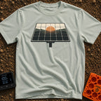 Powered By Dawn - T-Shirt in Bay - A vintage-style illustration of a pole-mounted solar panel. The grid of the panel...