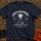 Squeezing Every Last Watt - T-Shirt in Navy - A black and white line-art illustration showing a portable solar panel...