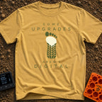 Upgrades Aren't Digital - T-Shirt in Mustard - A graphic showing a bare human footprint whose lower half seamlessly...
