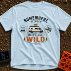 Between Wifi And Wild - T-Shirt in Chambray - A graphic of a white camper van with a full battery icon above it,...