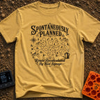 Planned To Be Spontaneous - T-Shirt in Mustard - A black and white illustration of a tangled, looping dotted path winding...