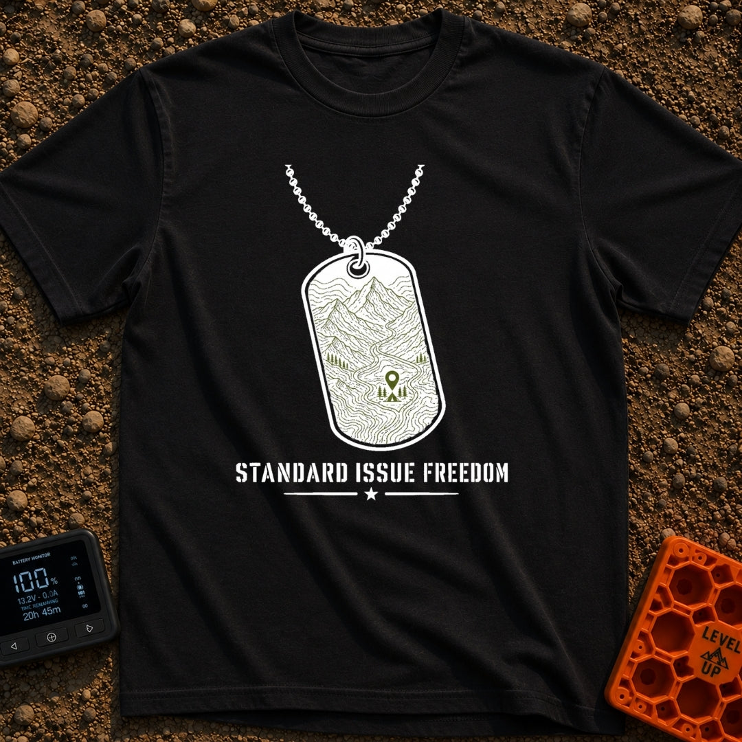 Standard Issue Freedom - T-Shirt in Black - A line-art illustration of a military dog tag hanging from a beaded chain,...