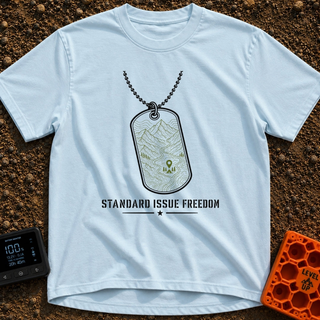 Standard Issue Freedom - T-Shirt in Chambray - A line-art illustration of a military dog tag hanging from a beaded chain,...
