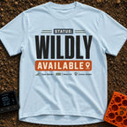 Wildly Available Status - T-Shirt in Chambray - A typographic design featuring the text "STATUS: WILDLY AVAILABLE"...
