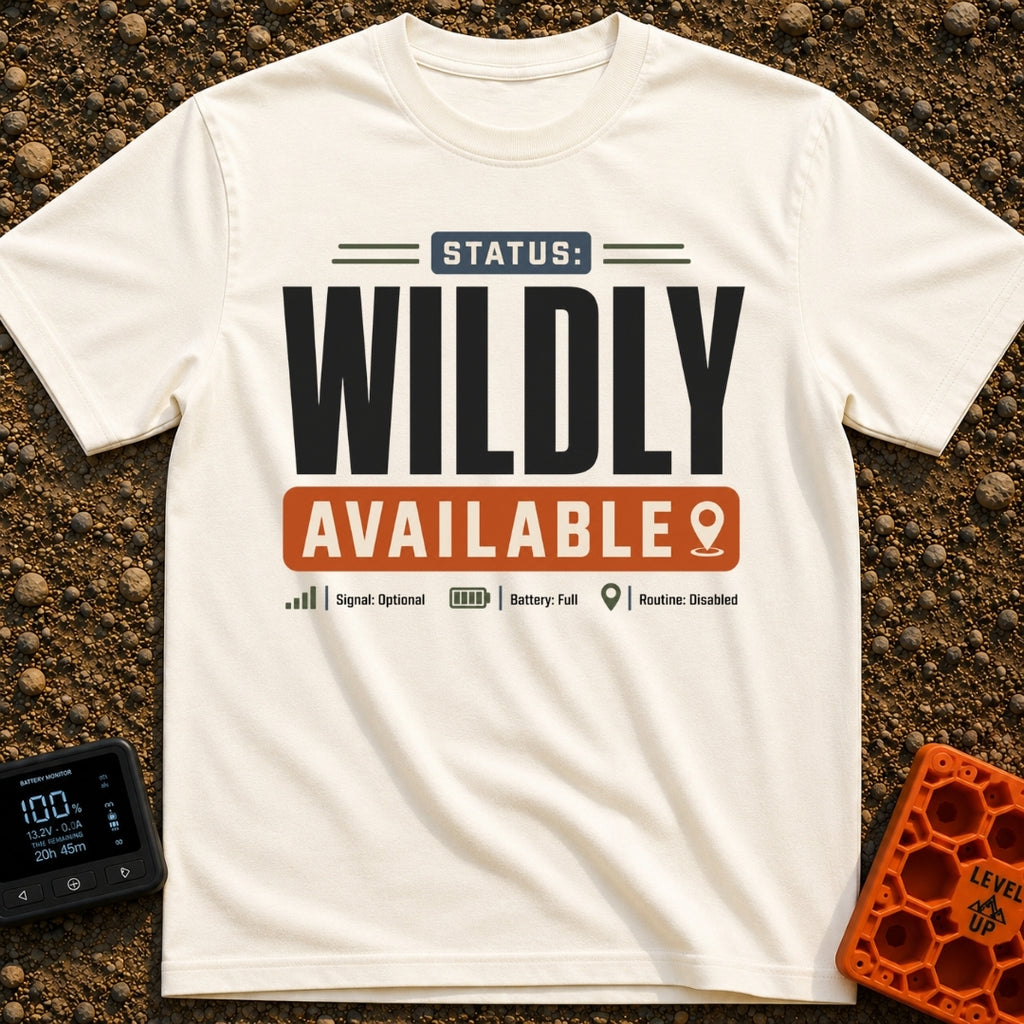 Wildly Available Status - T-Shirt in Ivory - A typographic design featuring the text "STATUS: WILDLY AVAILABLE" stacked...