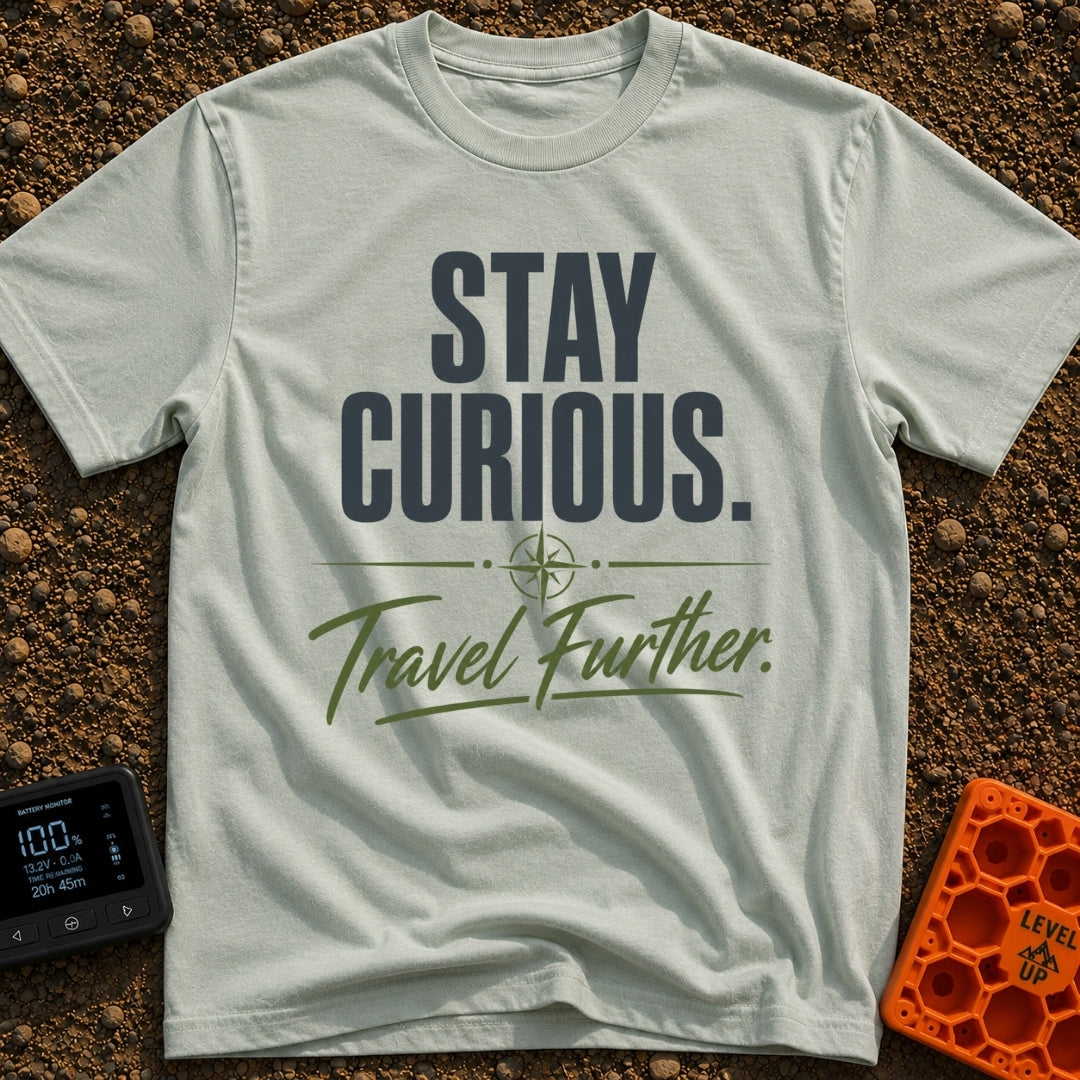 Curiosity Travels Further - T-Shirt in Bay - A typographic design featuring the words "STAY CURIOUS." in large, dark...