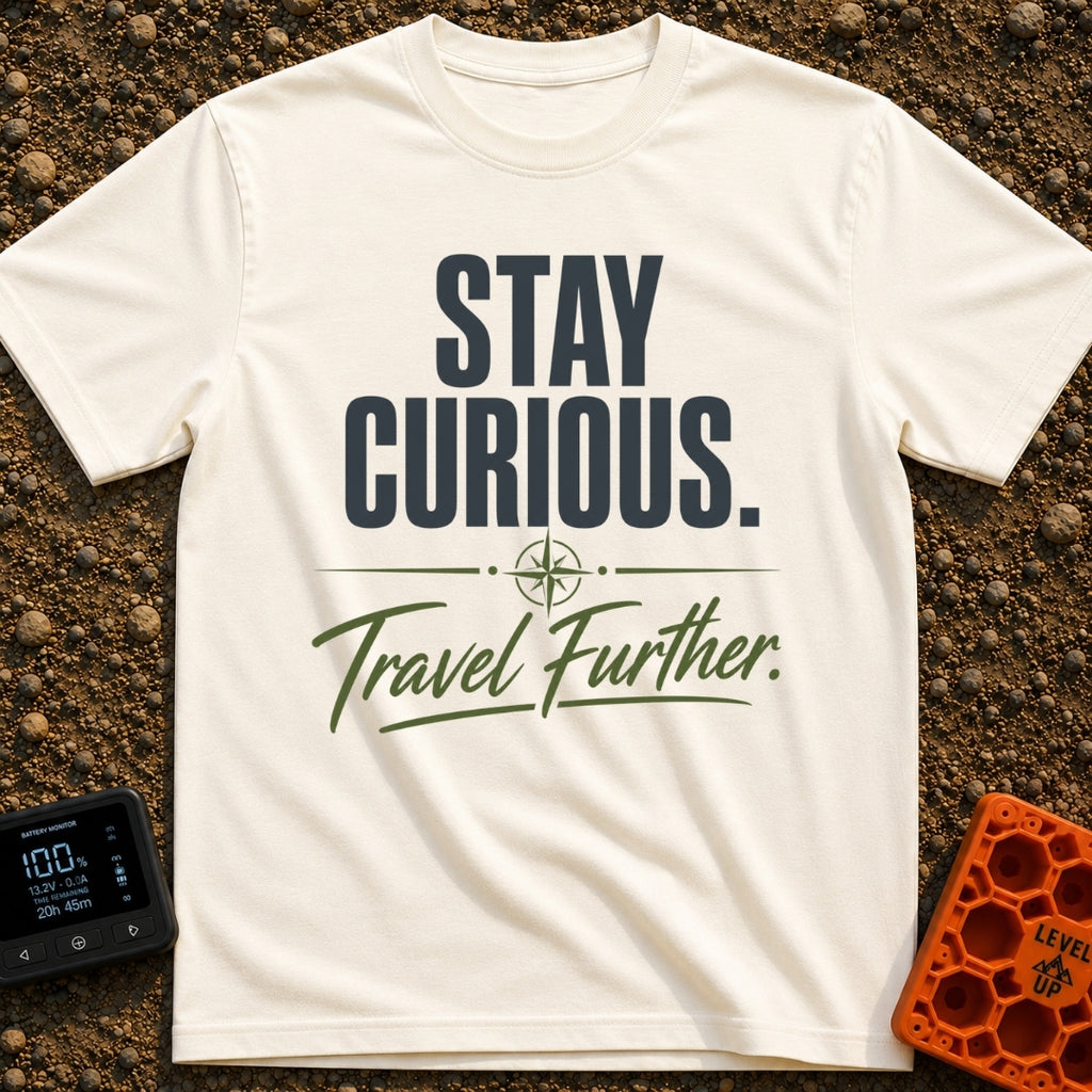 Curiosity Travels Further - T-Shirt in Ivory - A typographic design featuring the words "STAY CURIOUS." in large, dark...