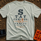 Eye On The Road - T-Shirt in Bay - A typographic design styled like an optometrist's eye chart that reads "STAY CURIOUS....