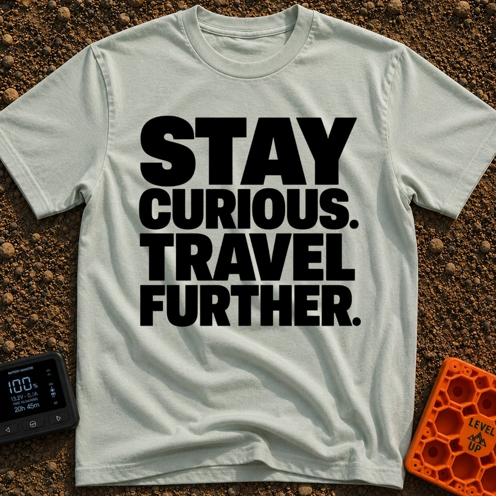 Driven By Curiosity - T-Shirt in Bay - A text-only design featuring the phrase "STAY CURIOUS. TRAVEL FURTHER." stacked in...