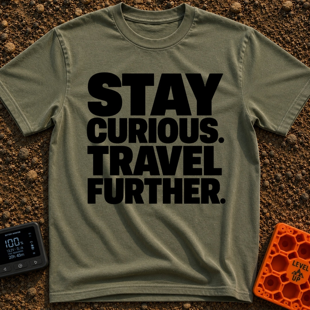 Driven By Curiosity - T-Shirt in Moss - A text-only design featuring the phrase "STAY CURIOUS. TRAVEL FURTHER." stacked...