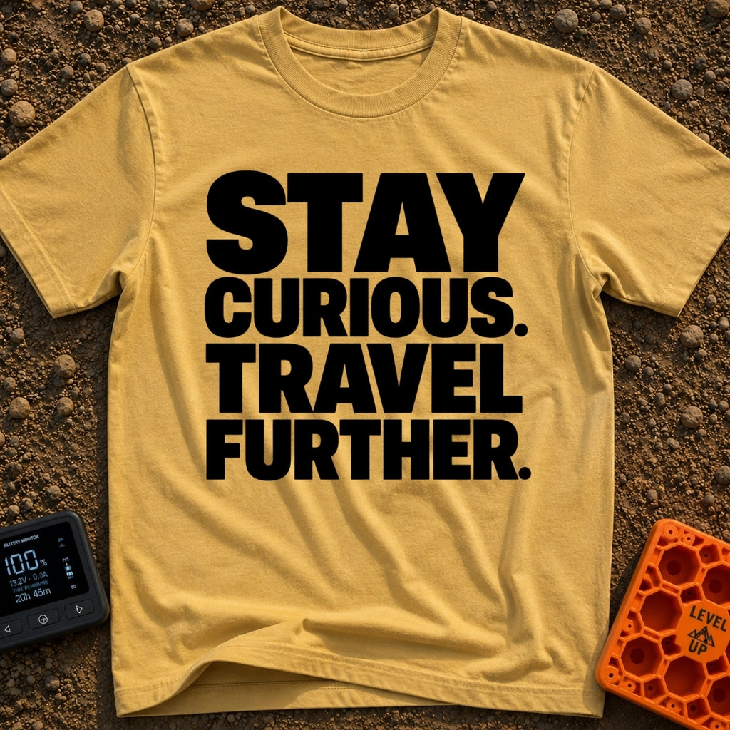 Driven By Curiosity - T-Shirt in Mustard - A text-only design featuring the phrase "STAY CURIOUS. TRAVEL FURTHER."...