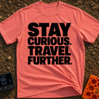 Driven By Curiosity - T-Shirt in Watermelon - A text-only design featuring the phrase "STAY CURIOUS. TRAVEL FURTHER."...