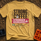 Caffeinated Boundary Boss - T-Shirt in Mustard - A typographic design reading "STRONG COFFEE STRONGER BOUNDARIES" and...