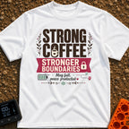 Caffeinated Boundary Boss - T-Shirt in White - A typographic design reading "STRONG COFFEE STRONGER BOUNDARIES" and "Mug...