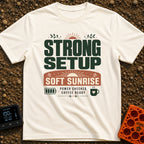 Charged And Caffeinated - T-Shirt in Ivory - A typographic design reading "STRONG SETUP SOFT SUNRISE" and "POWER CHECKED,...