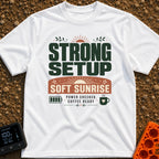 Charged And Caffeinated - T-Shirt in White - A typographic design reading "STRONG SETUP SOFT SUNRISE" and "POWER CHECKED,...
