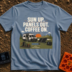 Panels Out Coffee On - T-Shirt in Blue Jean - A white camper van is parked with its side door open near a lake and...