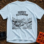 Endless Sunset Views - T-Shirt in Chambray - A black and white line drawing of a man in a plaid shirt standing next to a...