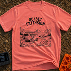 Endless Sunset Views - T-Shirt in Watermelon - A black and white line drawing of a man in a plaid shirt standing next to...